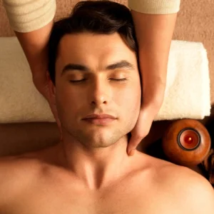 Masseur doing neck massage on man in the spa salon.